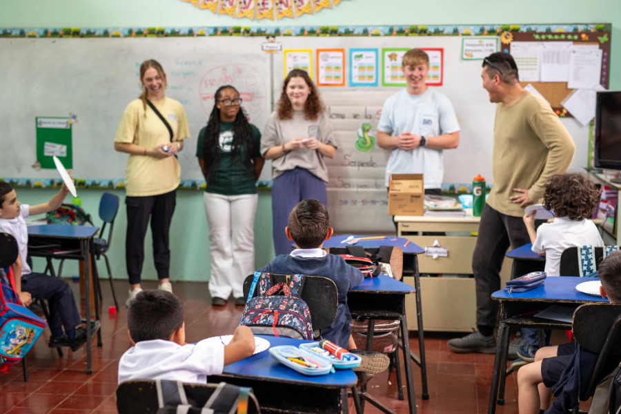 Students on a Baylor mission trip teaching a class of elementary schoolers